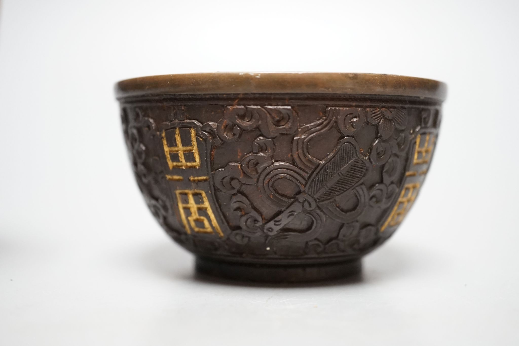 A Chinese coconut cup, 18th/19th century., 8.5 cms diameter.